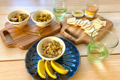 Seafood Tapas box, including Lobster Pate spread, Mussels in Pickled Sauce, Cockles in Brine, Vegan Crackers and Anchovies Stuffed Olives.