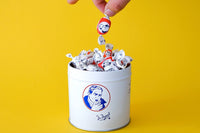 the secret recipe for some medicinal sweets, closely guarded. inside a metal can engraved with the image of a man coughing.