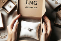 Thgis Picture Shows A Person Holding a Branded Shipping Box Showing a Jewelry Pillow with A 3 Carrot Diamond Ring center