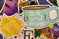 Pic shows assortment of stickers as an example of what can come in a Quirky Pickle pack. In this pic there is a coffee mug sticker.