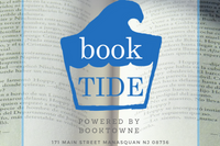 A beach scene with a subscription box from BookTIDE featuring great reads and colorful glass floats