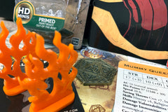 Dungeon Crate™ subscription box featuring exclusive member card, flame miniatures, and a treasure token for roleplaying games