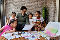 "Screen-free fun for the whole family!" (A happy family enjoying our "Mistakes are proof you are trying" box.)