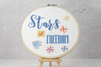 stars of freedom for july 4th and independence day with red, white and blue fireworks surrounding the words.