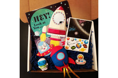 Colorful activity sheets from The Storytime Box featuring counting and addition exercises for children in a subscription box