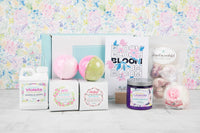 Bloom Bath Bevy Subscription box with bath bombs, whipped soap scrub, bubble barh jug, bubble taffy and flower bath bomb