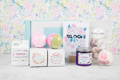 Bloom Bath Bevy Subscription box with bath bombs, whipped soap scrub, bubble barh jug, bubble taffy and flower bath bomb