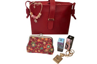 September '23 Ladies Box contains a crossbody bag, coin purse, 2 3ml parfum samples, keychain and rose gold toned Pandora style bracelet.