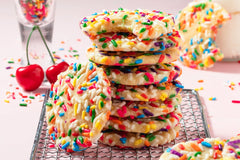 Our fun and delicious sprinkle are sugar cookie based and coved in colorful sprinkles . So much fun for birthday parties or just to eat home