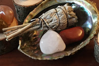 White Sage with an Albacore Shell for smudging. 
Red Jasper and White Quartz for grounding and protection.