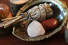 White Sage with an Albacore Shell for smudging. 
Red Jasper and White Quartz for grounding and protection.