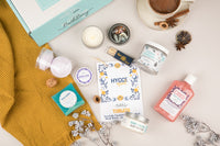 Tubless Bath Bevy Subscription box with body wash, whipped soap scrub, candle, matches, bar soap, and shower steamers