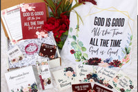 A cozy arrangement of fall-themed items in the Believer's Box VP, featuring socks, a candle, and a faith-inspired book