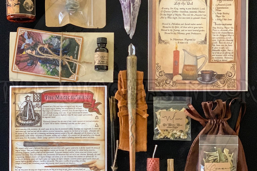 Items from a The Witches Moon subscription box, including a magic wand with a crystal in it, informational cards and more.