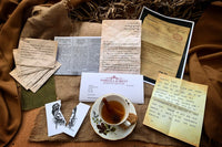 Vintage letters and hand draw sketches, postcards, coded notes photocopied documents and a cup of tea