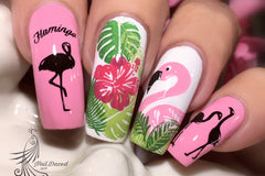 Photo of long nails with stamping nail art. Pink nails with flamingos stamped and white nails with a pink hibiscus flower and green foliage.