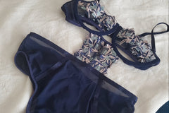 Embroidered bodysuit with sexy cut outs in the right places.