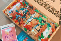 An open Zero Pack subscription box filled with sugar free energy drinks.