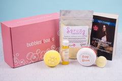 Bubbles & Books subscription box featuring a romantic novel, handmade soap, and bath products for relaxation