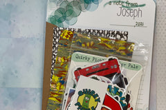 Pic shows a personalized Quirky Pickle pack with custom stationery, postcards, and stickers, ready to be packed and mailed.