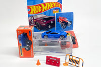 The Hot Wheels HotBox is a monthly subscription box containing a personalized car, additional new cars, display case, and accessories.