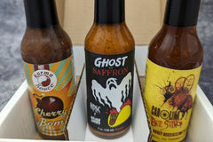 SCOVILLED subscription box featuring Karma Sauce, High Desert Sauce Co x Brian Ambs, and Up All Night Bottling Co.