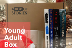 Brown subscription box filled with four young adult light reading books, featuring engaging stories and relatable characters for teen reader