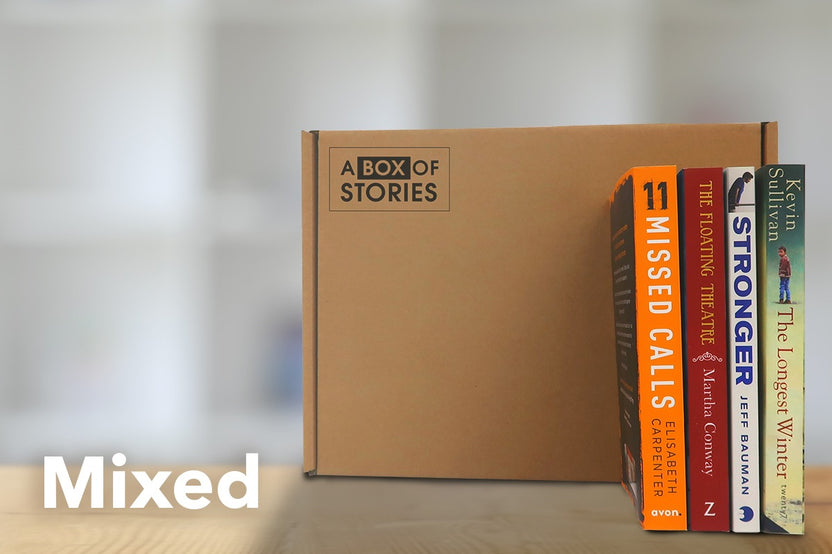 Brown box filled with a diverse collection of books in multiple genres, including crime thrillers, romance, and fantasy