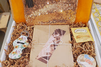 September Box 2020 (Chapter Book Age Group) - Included monthly book, button pins, fun make-up pouches, and more.