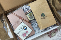 - ActionPlanner 
- 12oz Bag of Coffee 
- Coaster 
- Candle
- Pen 

*Items varies and theme changes. 
