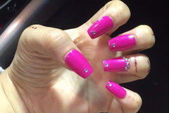 Set name: Genie. Hot pink based nails with single silver rhinestones on the tip of each nail and along the bottom of ring finger nail.