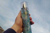 various bath and body works products, jade roller, peel of mask and bath and body works gigham candle.