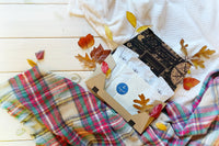 A hand pours tea from a kettle into a cup beside a Tea Runners subscription box and loose leaf tea packages