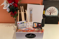 Enjoy a Paint and Sip Box or give as a gift. Each box contains an easel, a canvas, paint, a tray, and brushes. 