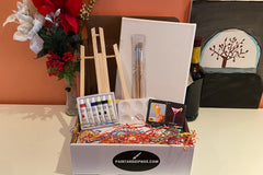 Enjoy a Paint and Sip Box or give as a gift. Each box contains an easel, a canvas, paint, a tray, and brushes. 