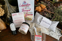 A red mug filled with three packets of Moonstruck milk chocolate, featured in the Peace & Pages monthly subscription box