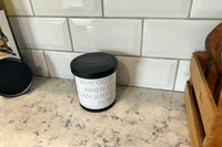 An example of our (1) scented candle subscription box featuring De-motivational/dark humor quotes. Fragrances and quotes will vary.