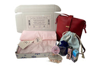 September '23 Ladies Box contains a crossbody bag, coin purse, 2 3ml parfum samples, keychain and rose gold toned Pandora style bracelet.
