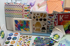 Pic shows an assortment of items as we prepare to pack them into subscriber packs based on age range. 