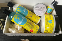 A batch of Her Crown and Glory subscription box featuring products from Curls Blueberry Bliss collection 