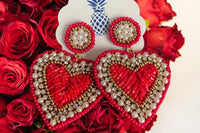 A romantic gift of Oliver Christopher's Boutique Box heart shaped earrings surrounded by roses.
