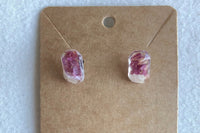 These earrings were made with stainless steel studs, resin and preserved petals from the Peony flower. 