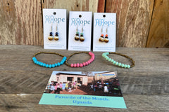Uganda Favorite of the Month featuring Smooth round bone earrings and a Namakula single Bracelet. Showing several colors.