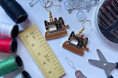 Colorful assortment of unique earrings including food and whimsical designs in the Monthly Earring Mania subscription box