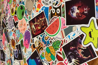 Pic shows assortment of stickers as an example of what can come in a Quirky Pickle pack. Stickers for packs are selected based on age range.