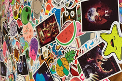 Pic shows assortment of stickers as an example of what can come in a Quirky Pickle pack. Stickers for packs are selected based on age range.