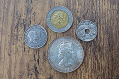 An example of foreign coins included in the coin collector's gift boxes, including Japanese yen, Philippine Peso, and more.