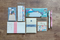 Packs by Misty Co. stationery subscription bundles with planner stickers, writing paper, sticky notes, memo pads and pens.