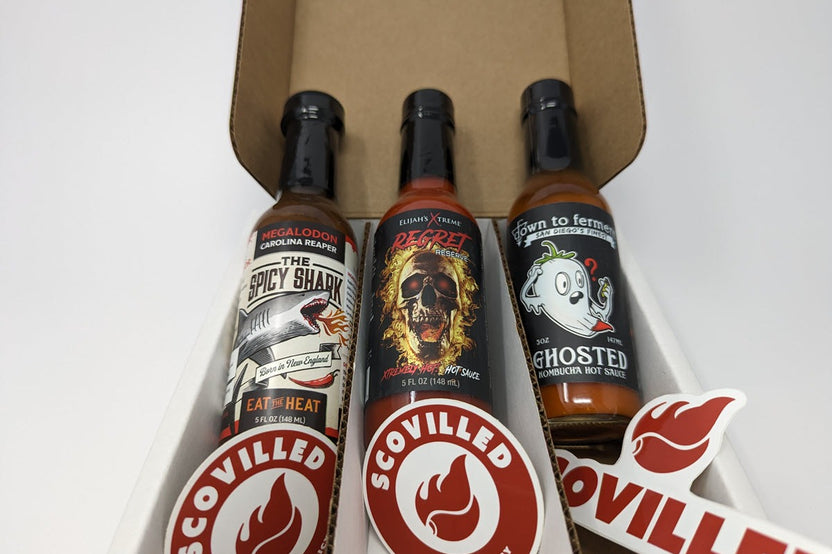 SCOVILLED hot sauce of the month subscription box featuring The Spicy Shark, Elijah's Xtreme, and Down to Ferment