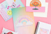 Body positive journal, keep gong with flower art greeting card, journal prompts card, and my journal spiral white notebook with heart art. 